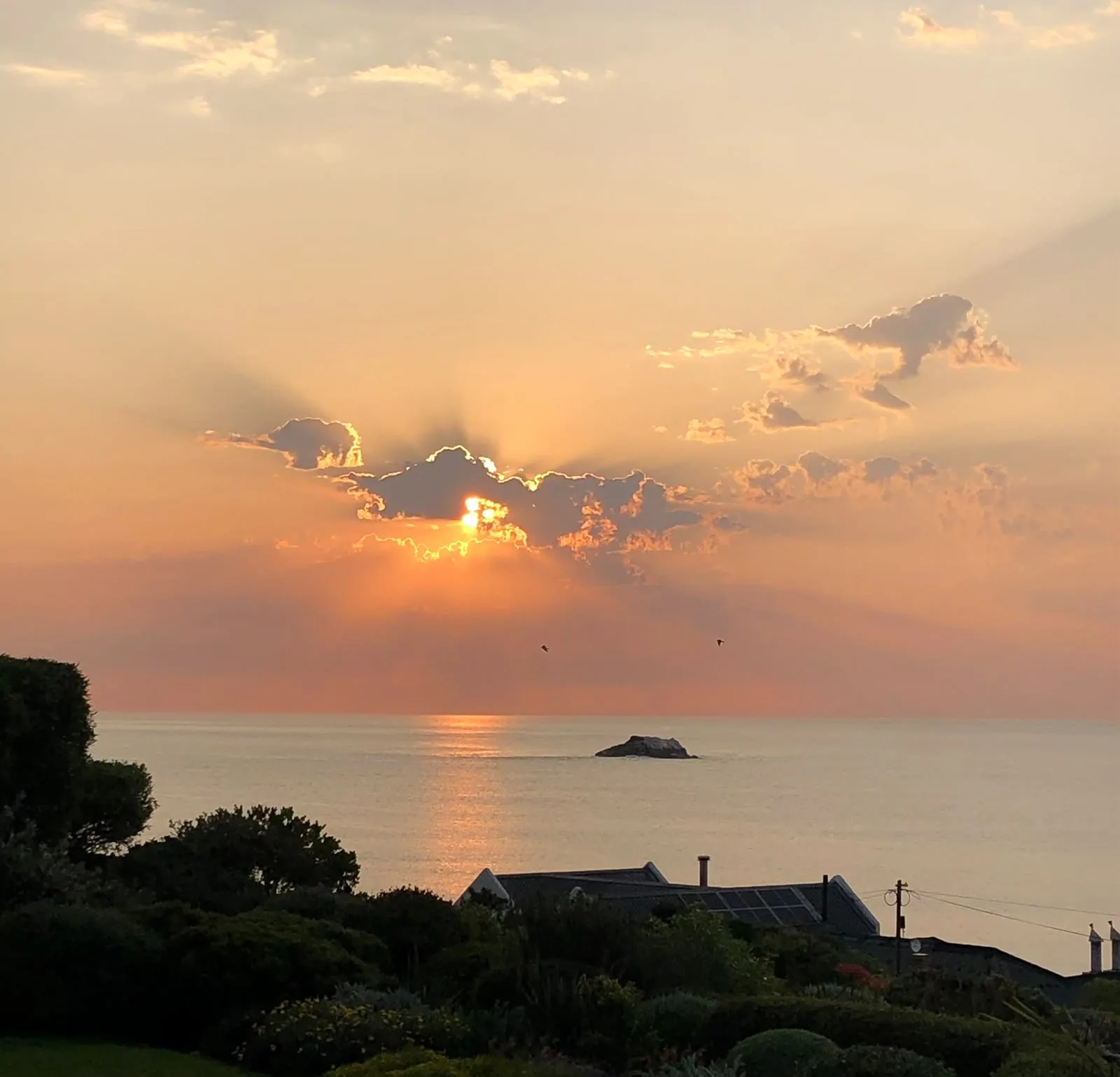 Sunset over the rock at Yzerfontein